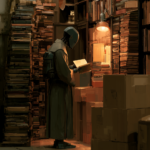 Das Geglaubte von gestern Person in a hazmat suit reads a book among stacks of books and cardboard boxes in a warm, dim warehouse-like library.